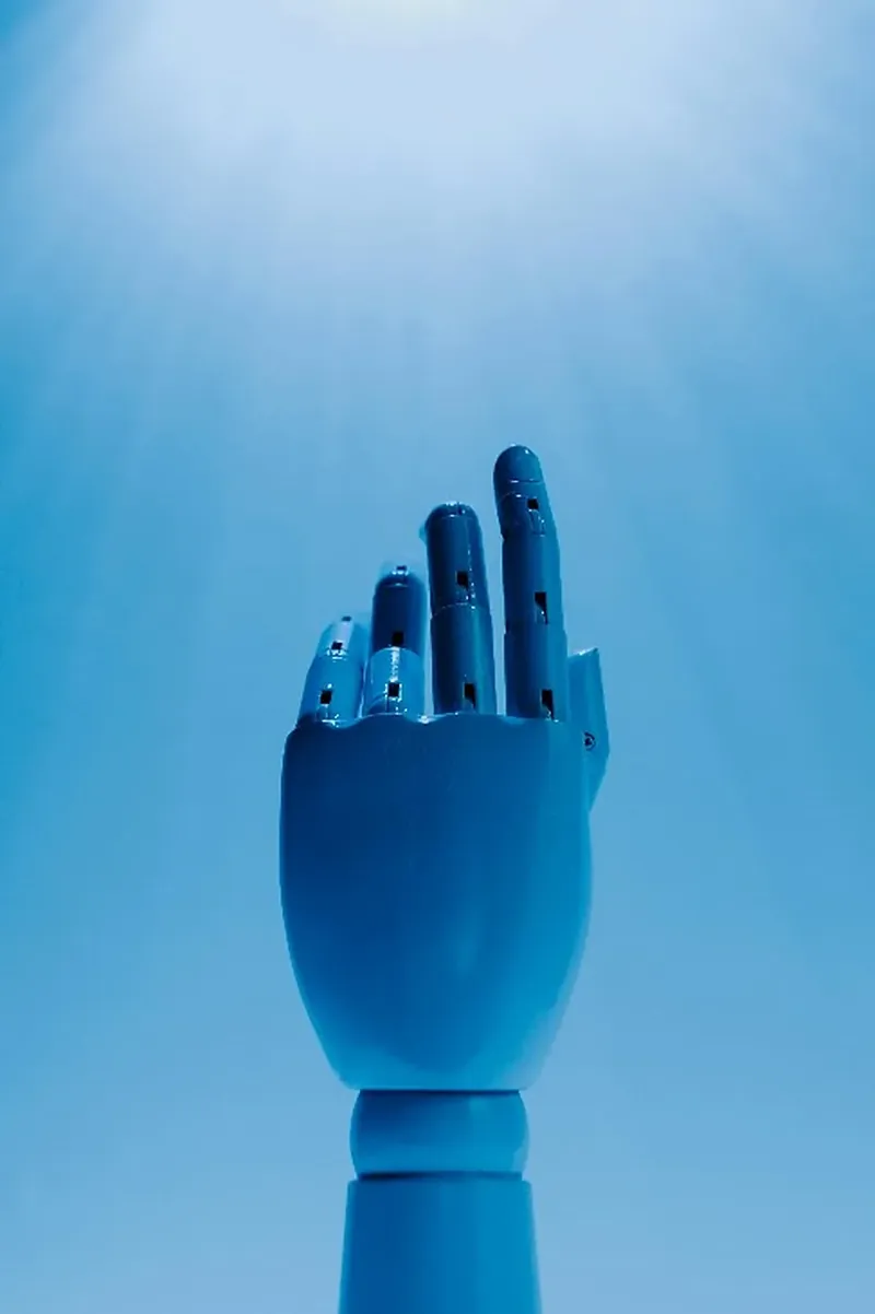 Illustrative blue robotic hand reaching upward against a sky-blue background